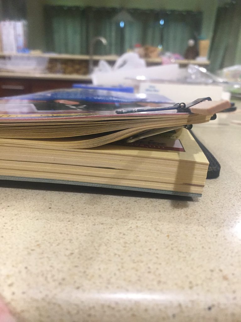 A picture of a paper clip I used as a clamp on the phone book